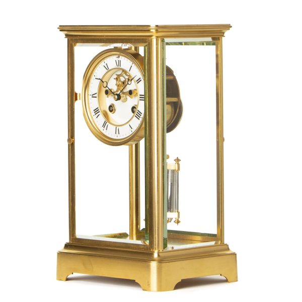 a-small-french-striking-four-glass-clock-side