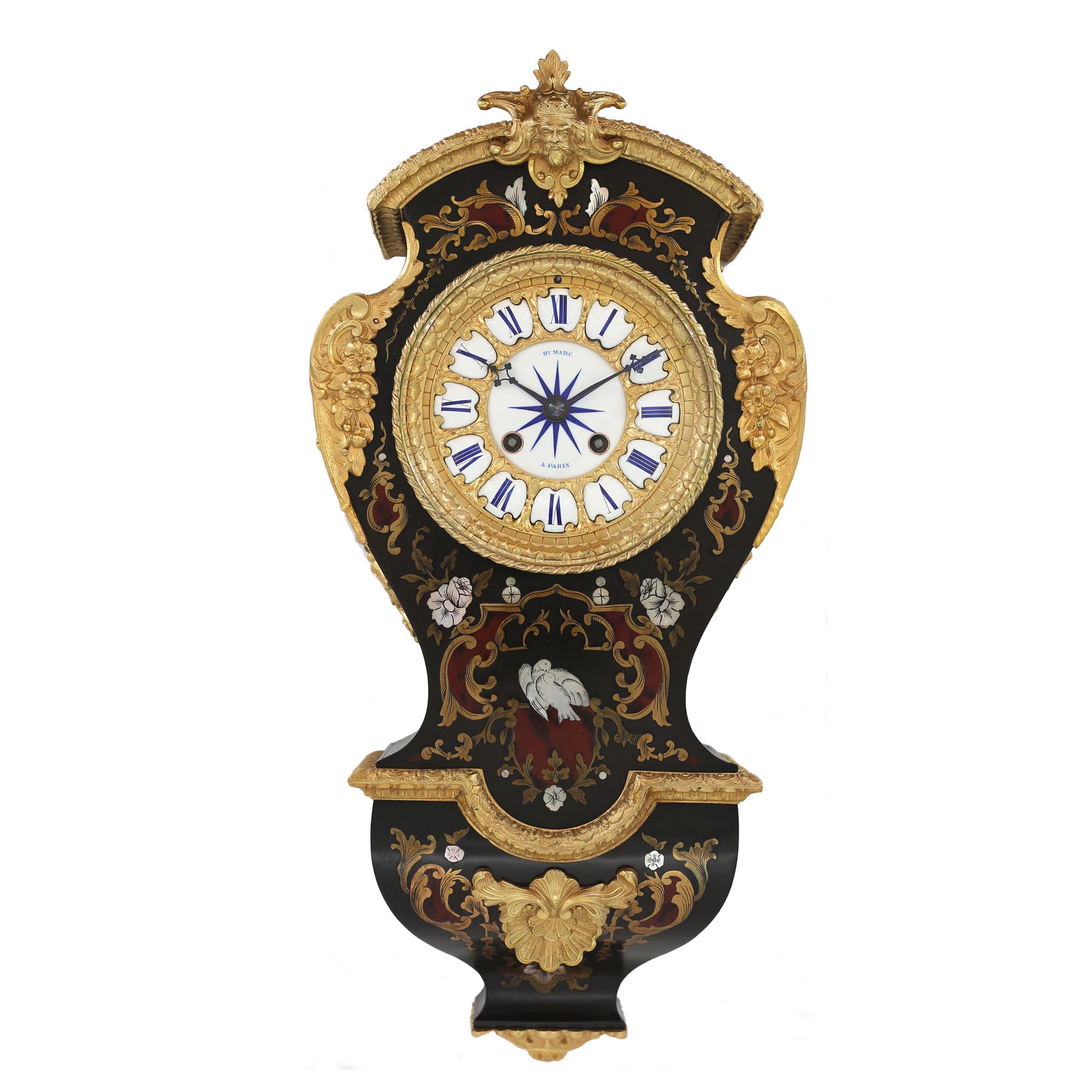 Henri Marc of Paris Boulle Wall Clock Standard French 8-day movement striking the hours and half hours on a bell, via a count-wheel. Brocot fine regulation in the dial above the 12 ‘o’ clock position. The Ormolu 4.5” dial features individual enamel cartouches and an enamel centre signed Hen Marc of Paris, all with blue decoration. Matching, finely pierced, blued steel hands. The case is of a most unusual design, featuring red Boulle and Mother of Pearle inlay, with quality Ormolu mounts. C.1850 Height: 17½” or 45cm £5,250